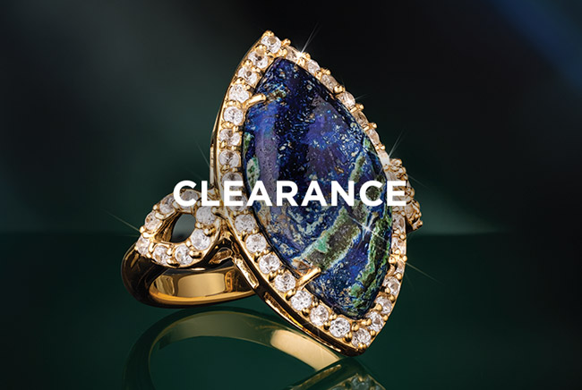 Gold earrings on black background